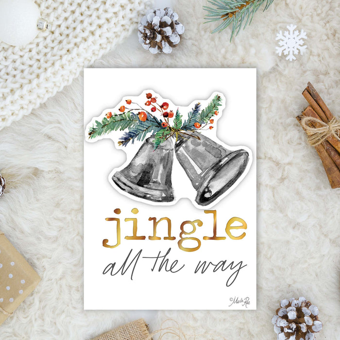Christmas-themed card with bells and 'jingle all the way' text on a textured surface with decorative elements.