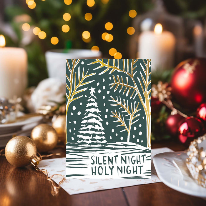 Christmas card with 'Silent Night, Holy Night' text on a festive background with candles and ornaments.