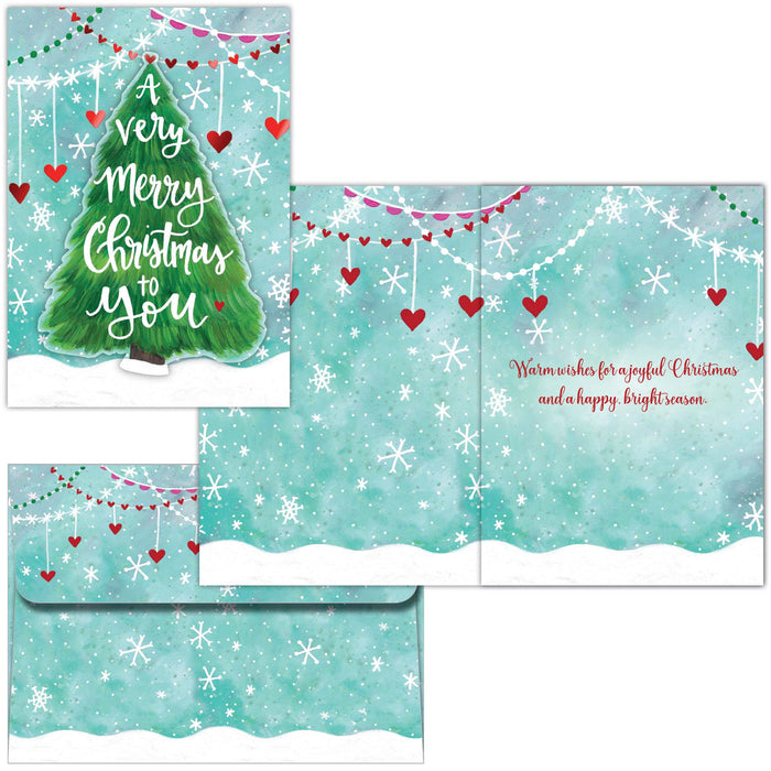 Set of Christmas cards with a green tree and snowflake design on a blue background.