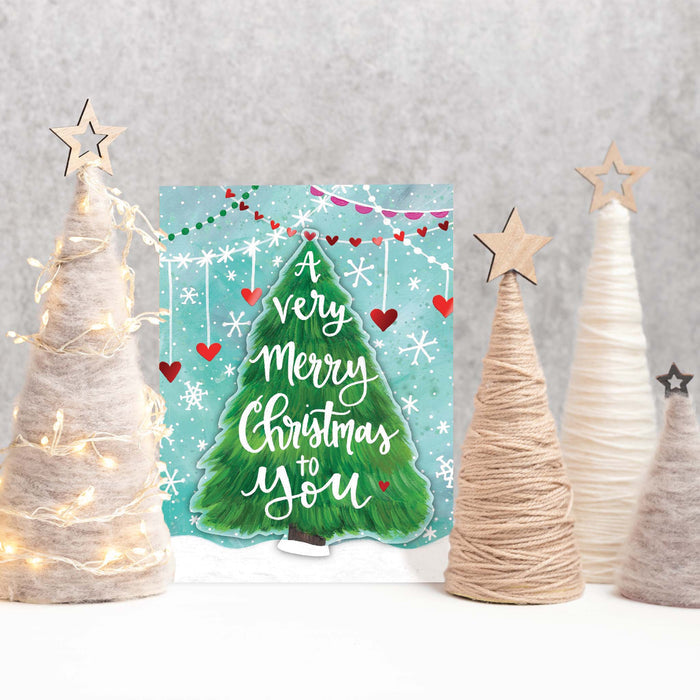 Christmas card with decorative trees and lights on a gray background