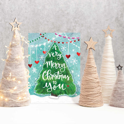 Christmas card with decorative trees and lights on a gray background