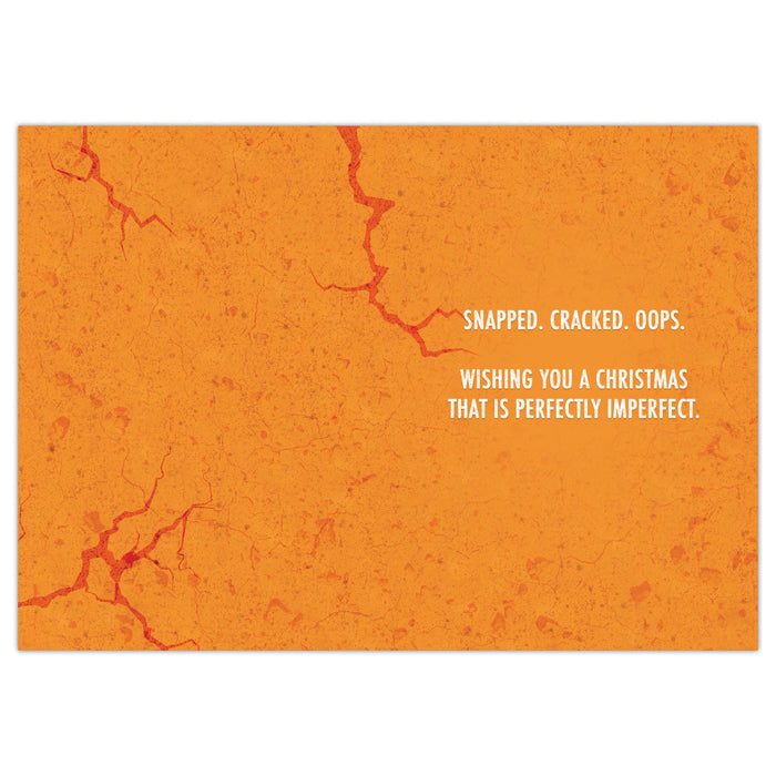 Orange inside of card with cracked texture and humorous Christmas message.