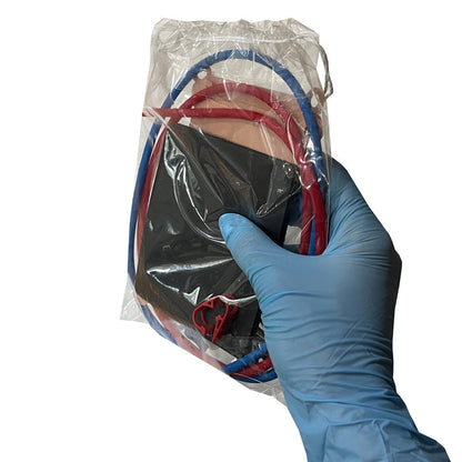 Supply Kit for Mochtech IV Trainer in packaging being held in hand