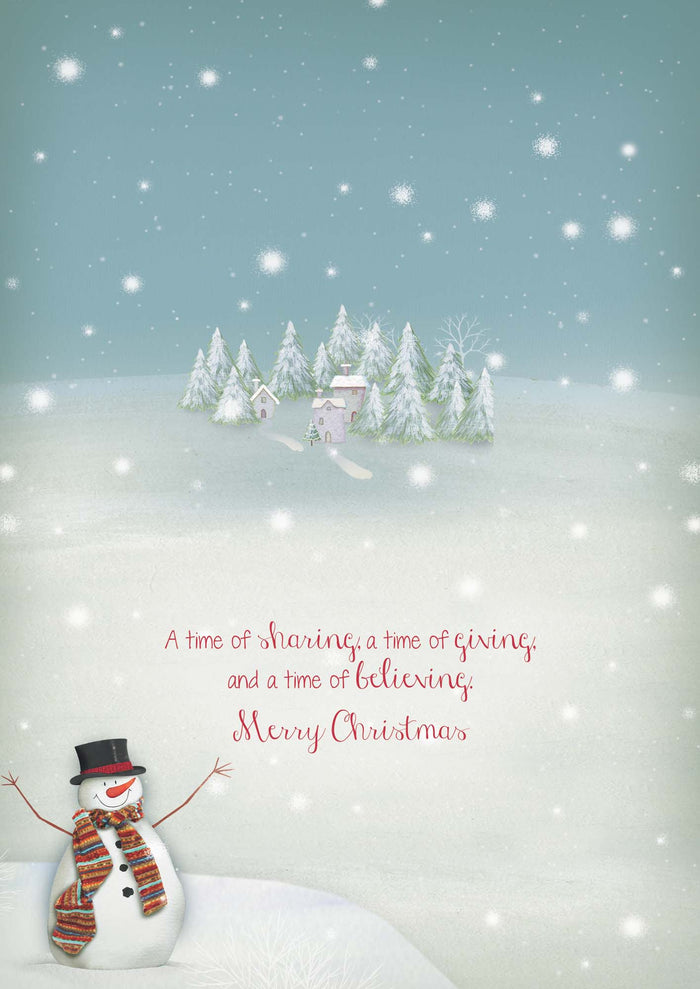 Snowman in a snowy landscape with trees and a small house, featuring a Christmas message.