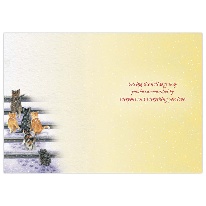 Card with cats on a snowy fence and text on a yellow background
