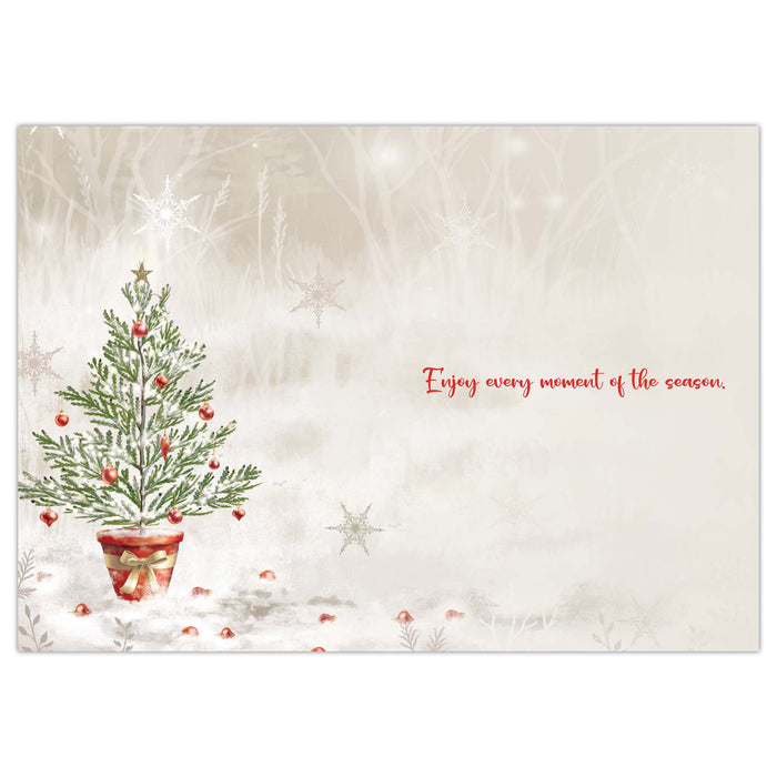 Christmas card with a decorated tree and text on a textured background