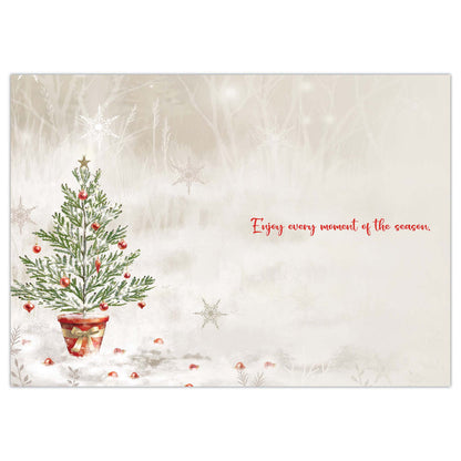 Christmas card with a decorated tree and text on a textured background
