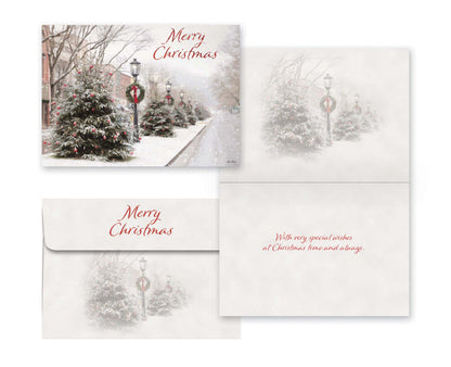 Christmas card with snowy street scene and 'Merry Christmas' text.