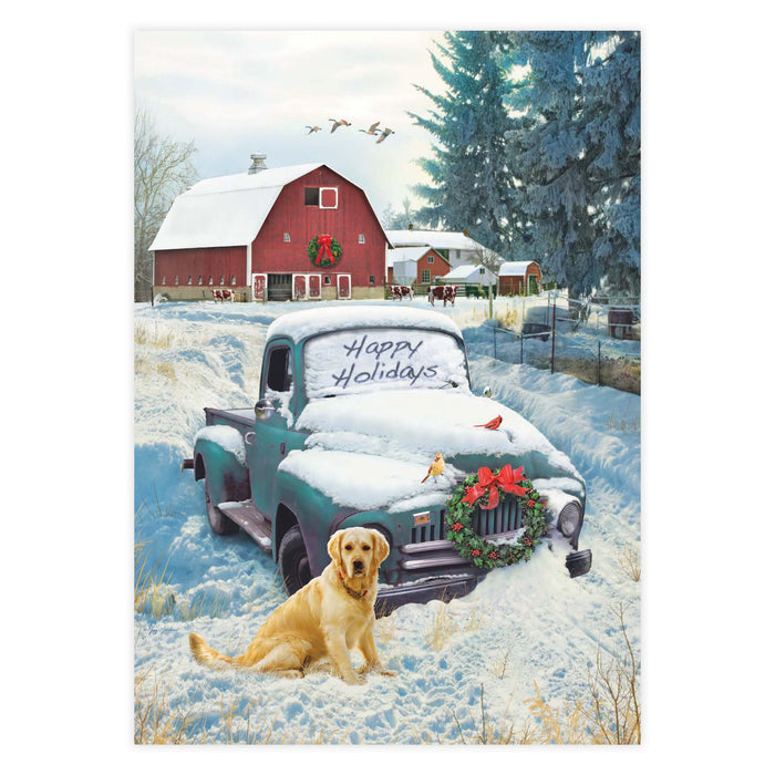 Winter scene with a snow-covered truck and dog in front of a red barn.