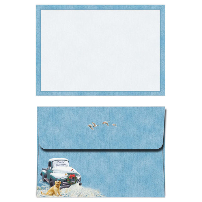 Set of stationery with a blue envelope featuring a winter scene and a white card.