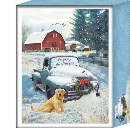 Framed winter scene with a snow-covered truck and dog, featuring a red barn and Christmas decorations.