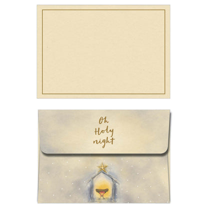 Christmas card with nativity scene and envelope on a white background