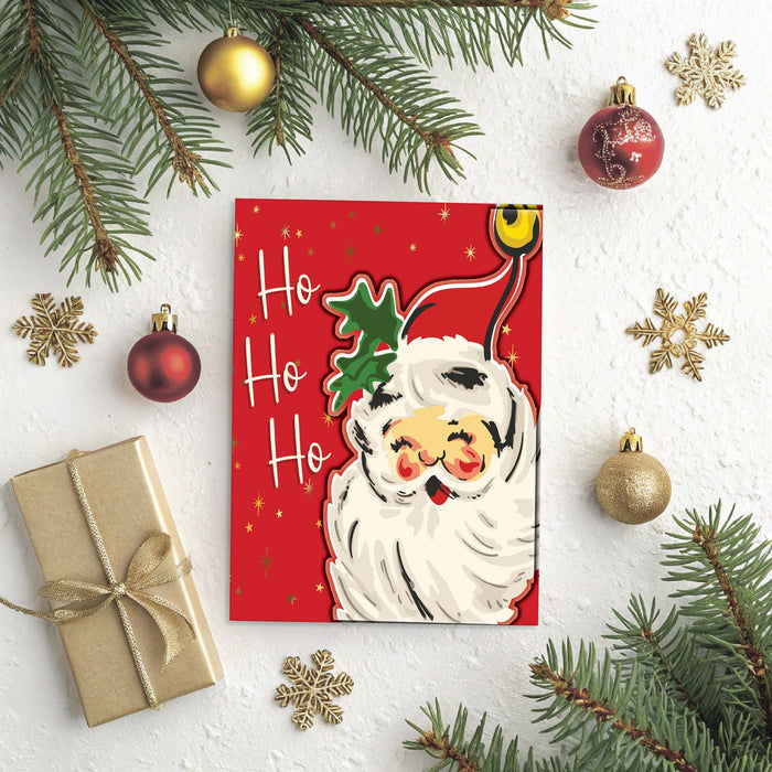 Red Christmas card with Santa Claus and 'Ho Ho Ho' text, surrounded by festive decorations on a white background.