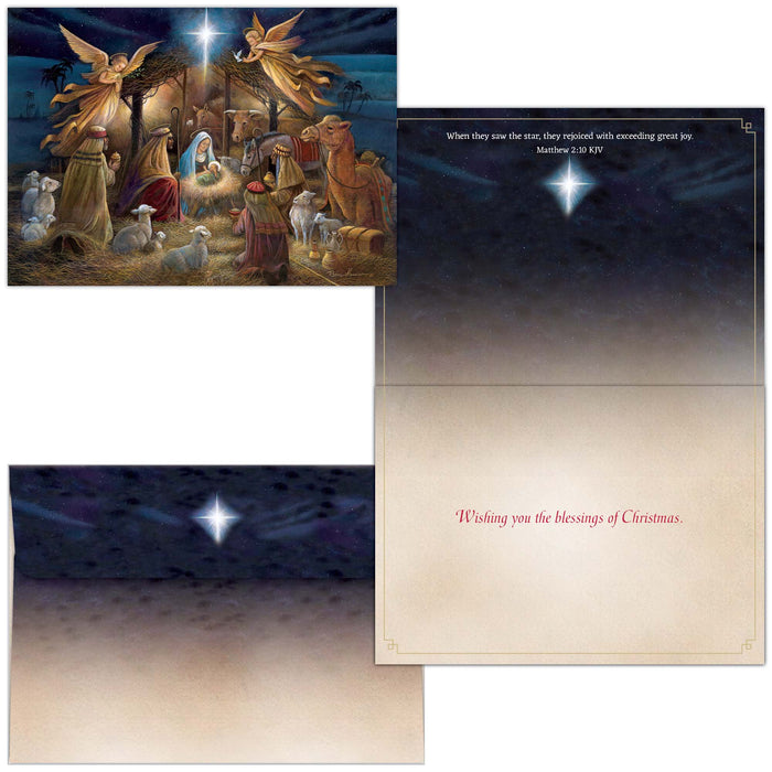 Christmas card with nativity scene and envelope featuring a star in the sky.