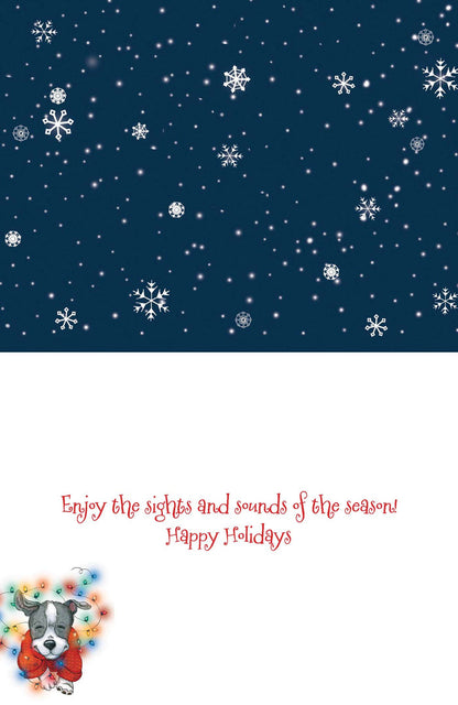 Holiday card with dog wearing a wreath, snowflakes, and text on a blue background