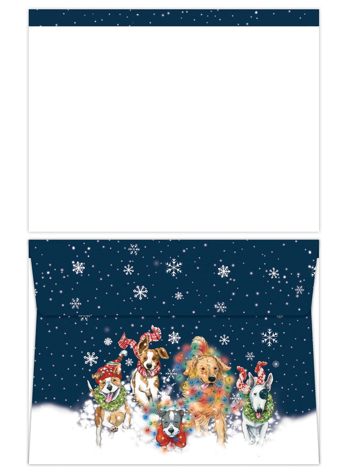 Christmas-themed envelope with dogs and snowflakes on a blue background
