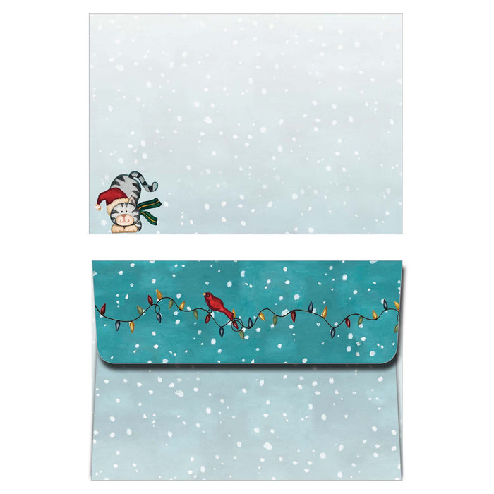Christmas-themed card with envelope on a snowy background