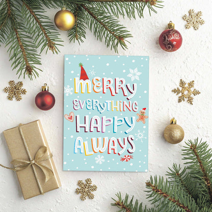 Christmas card with 'Merry Everything Happy Always' text, surrounded by festive decorations on a white background.