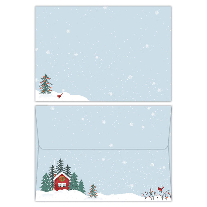 Envelope with a cabin and trees on a snowy background.