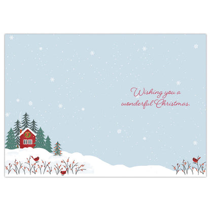Christmas card with a snowy landscape, red cabin, and 'Wishing you a wonderful Christmas' text.