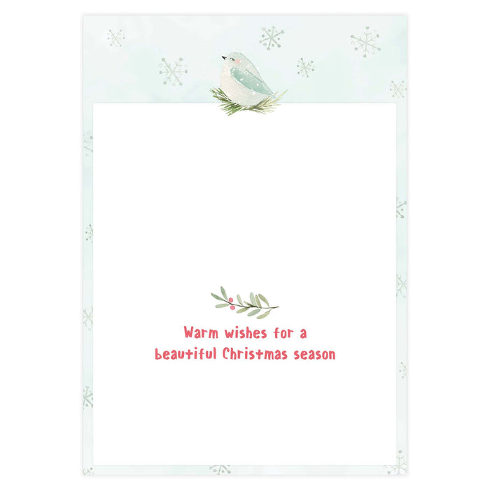 Holiday card with a bird and foliage design on a light blue background with snowflakes.