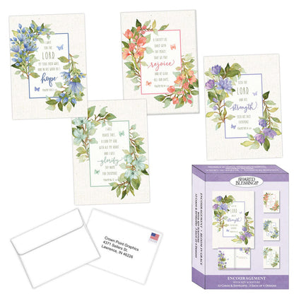 Set of encouragement cards with floral designs and a packaging box on a white background