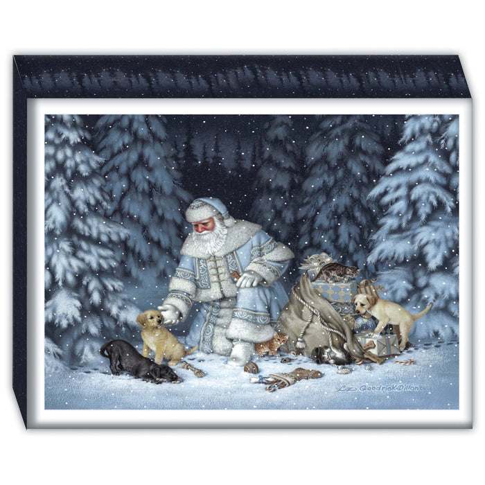 Box of Christmas cards with a winter scene with a person in a snowy landscape surrounded by dogs.