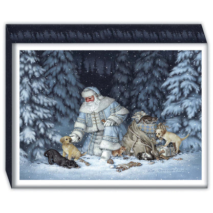 Box of Christmas cards with a winter scene with a person in a snowy landscape surrounded by dogs.