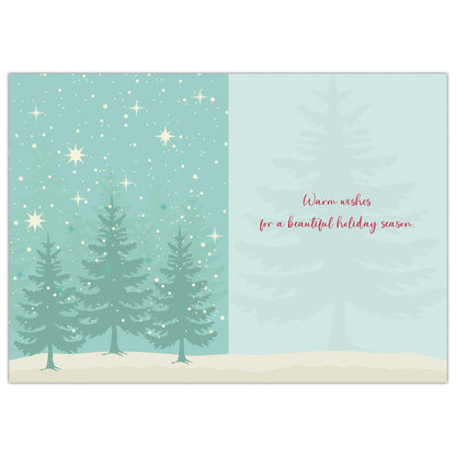 Holiday card with trees and stars on a light blue background