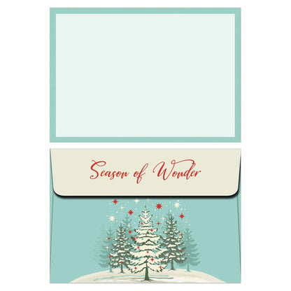 Christmas card with trees and 'Season of Wonder' text on a light blue background